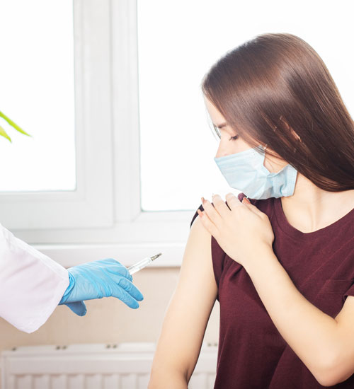 Doctor,Giving,A,Senior,Woman,A,Vaccination.,Virus,Protection.,Covid-2019.
