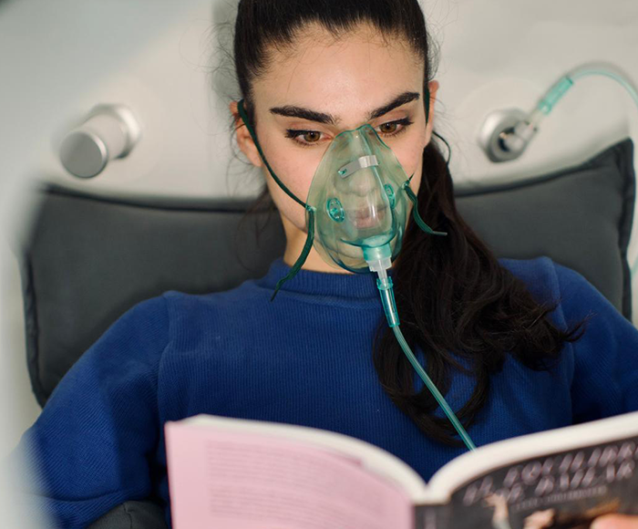 Mujer haciendo yoga | Oxien | Beneficios MP